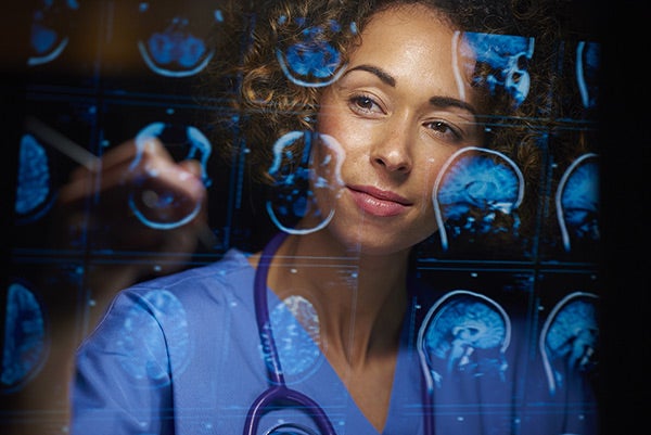 neurosurgeon checking mri scan